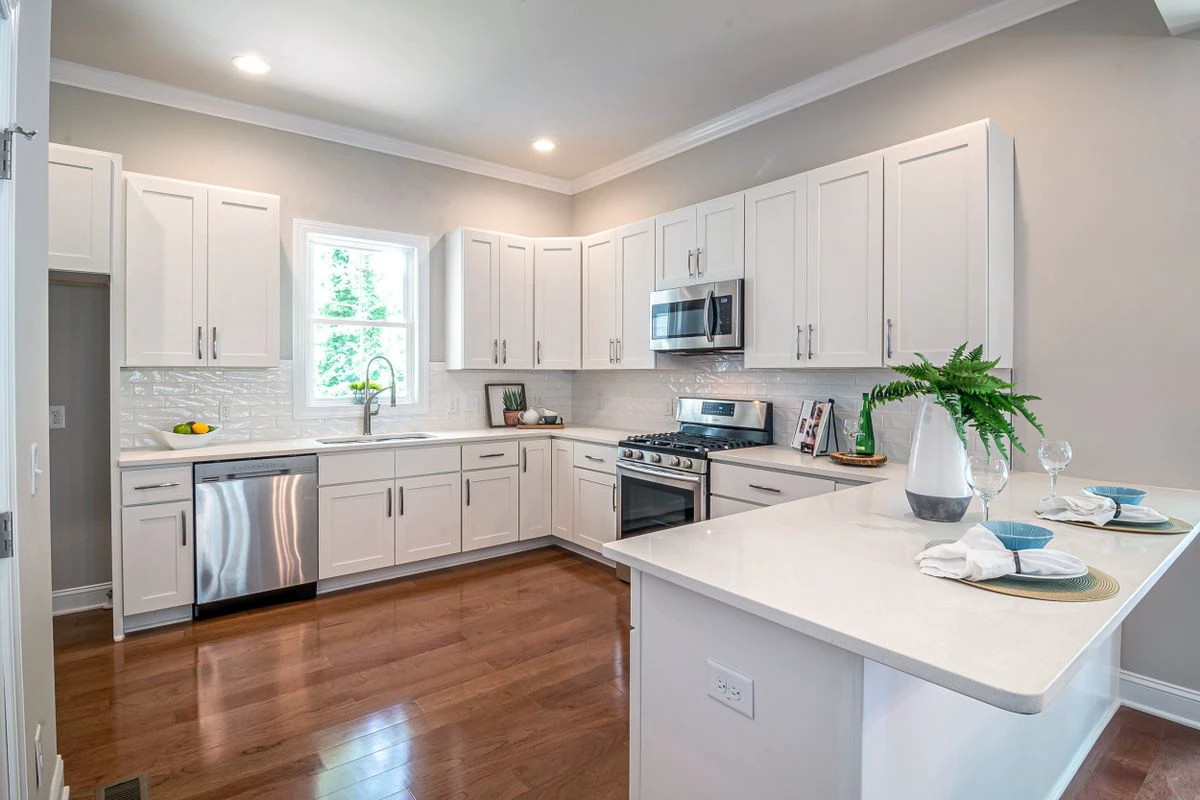 Pre-assembled kitchen cabinets installed in a bright kitchen